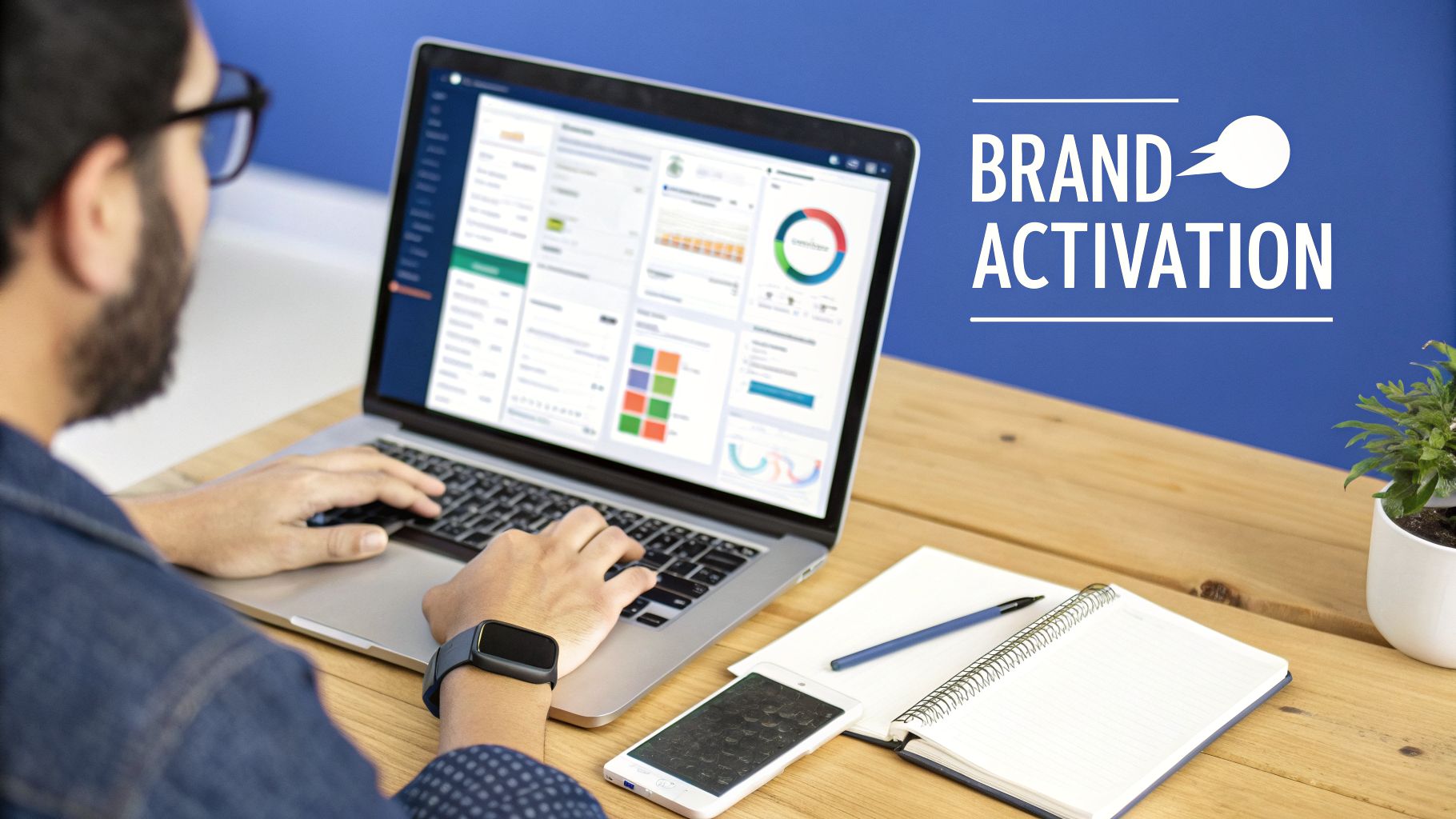 A person views business analytics on a laptop, with a smartphone, notebook, and "BRAND ACTIVATION" graphic.