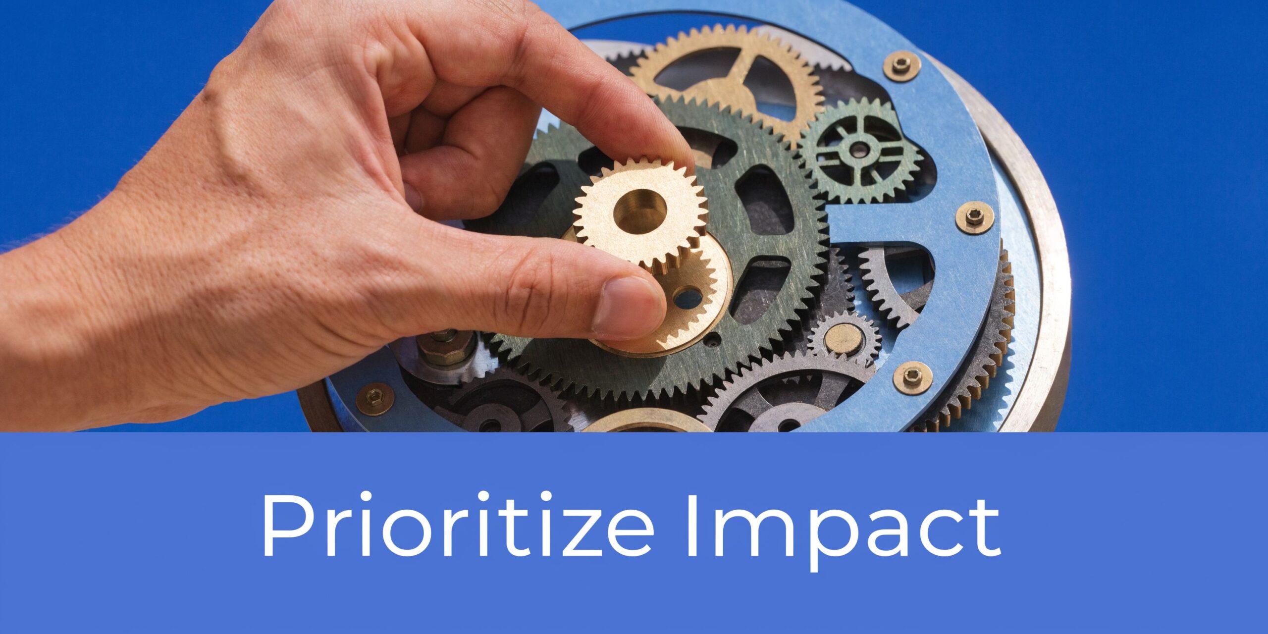 A hand placing a small gear into a larger mechanical assembly representing strategic business improvement.