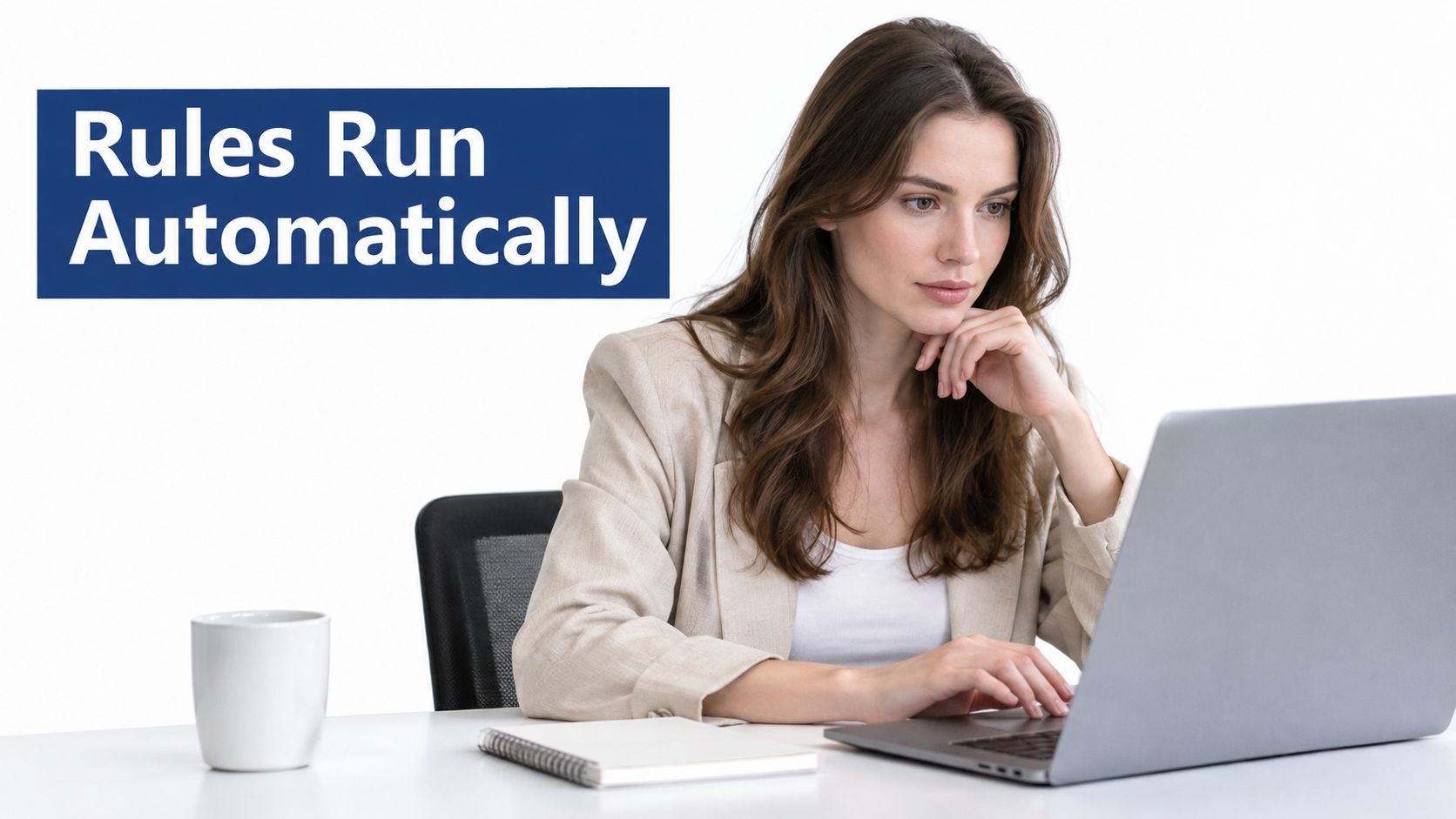 A professional woman working on a laptop with the text Rules Run Automatically displayed on screen.